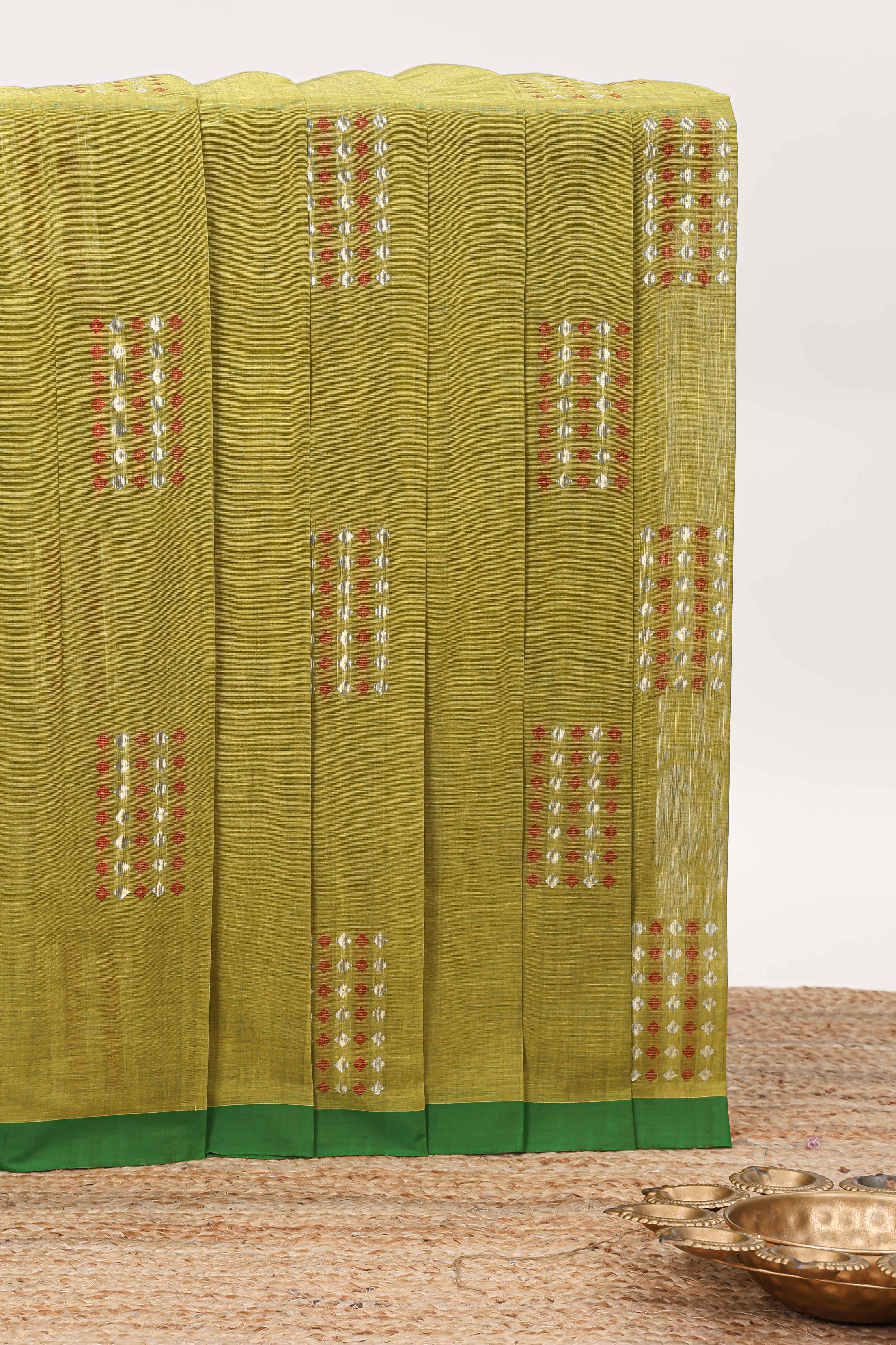 Green geometric pattern kovai cotton saree with contrast border and checked design pallu and matching blouse