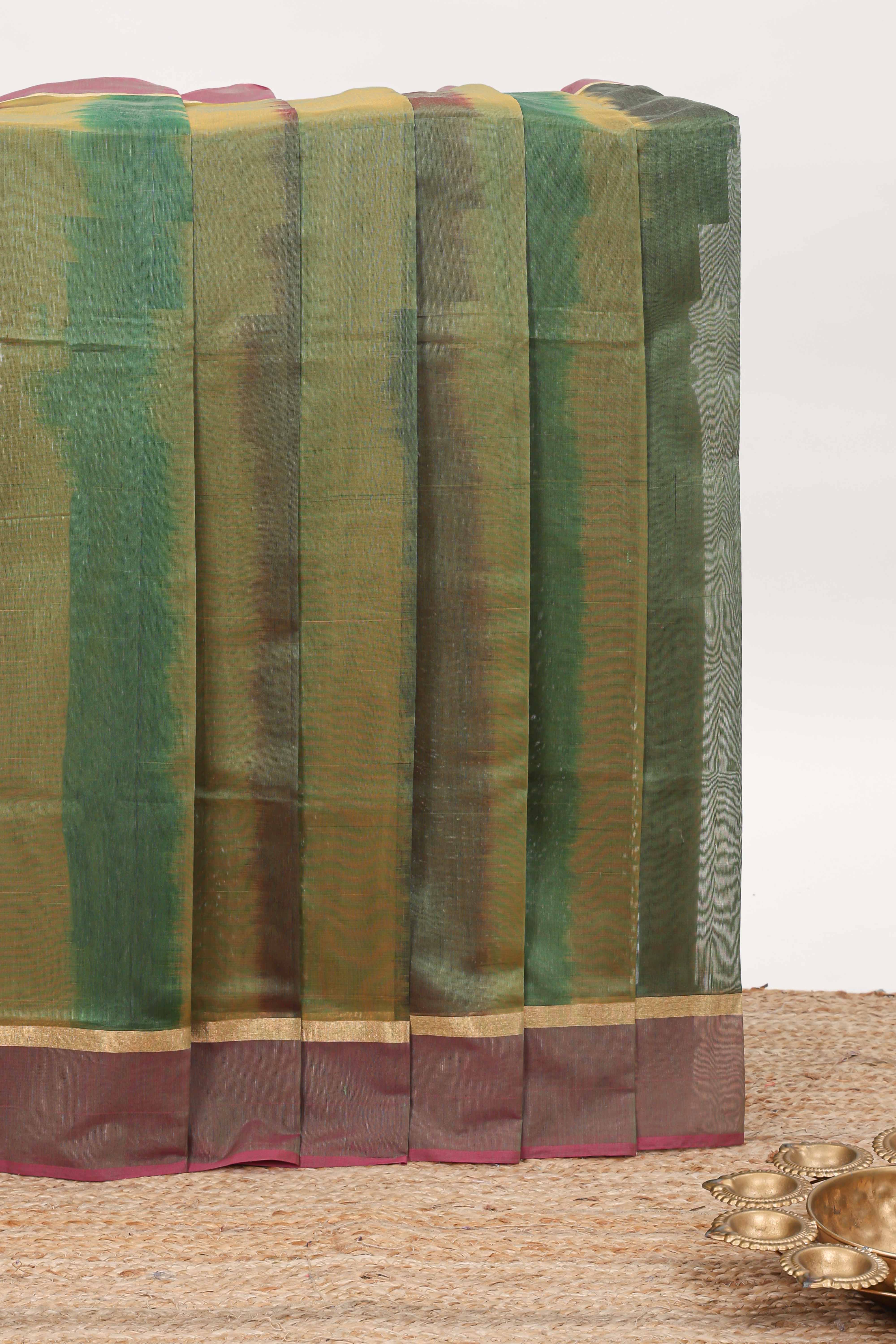 Green plain ikkat cotton saree with contrast border and zari striped pallu