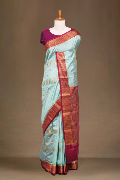 Teal raw silk woven border saree