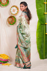 Pastel green floral and animal themed banarasi silk saree with contrast border matching blouse